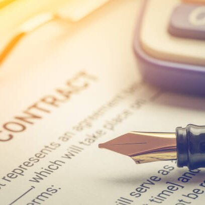 Business legal document, contract / agreement concept : Fountain pen on a business contract, a form on a clipboard. Contract is a voluntary, deliberate and legally binding agreement between parties.